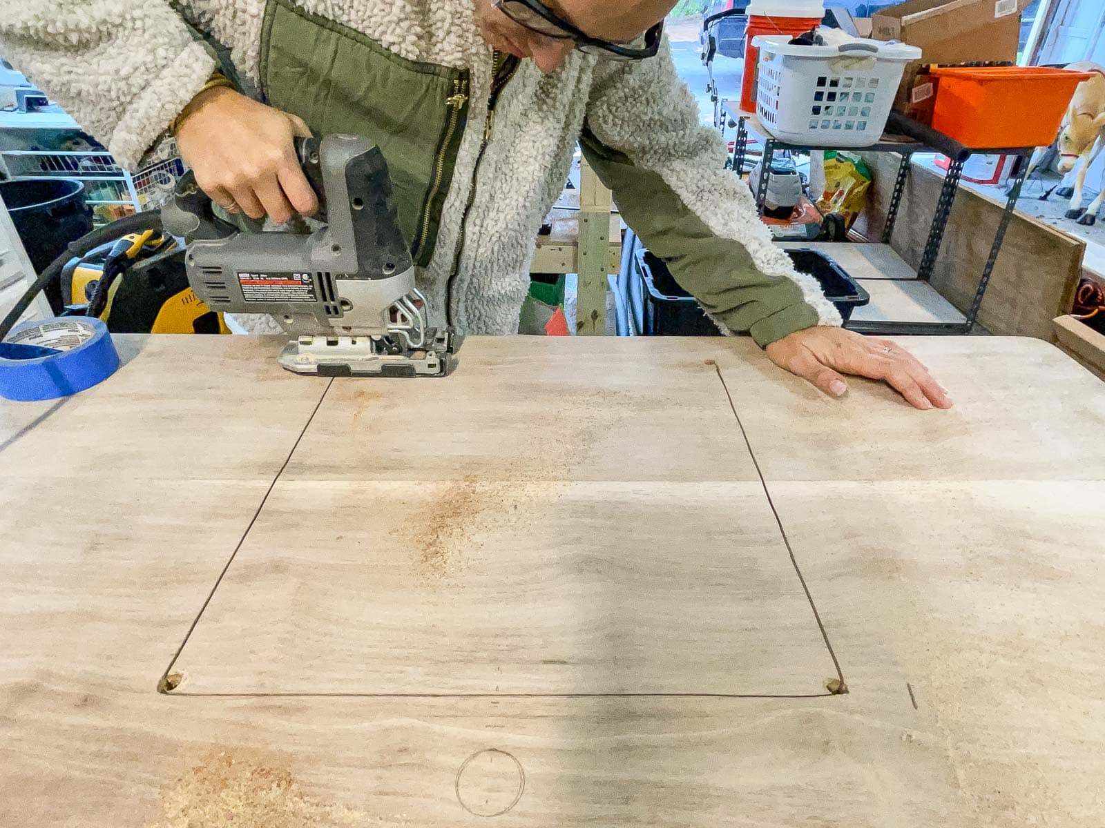use a jigsaw to cut a hole for the sink