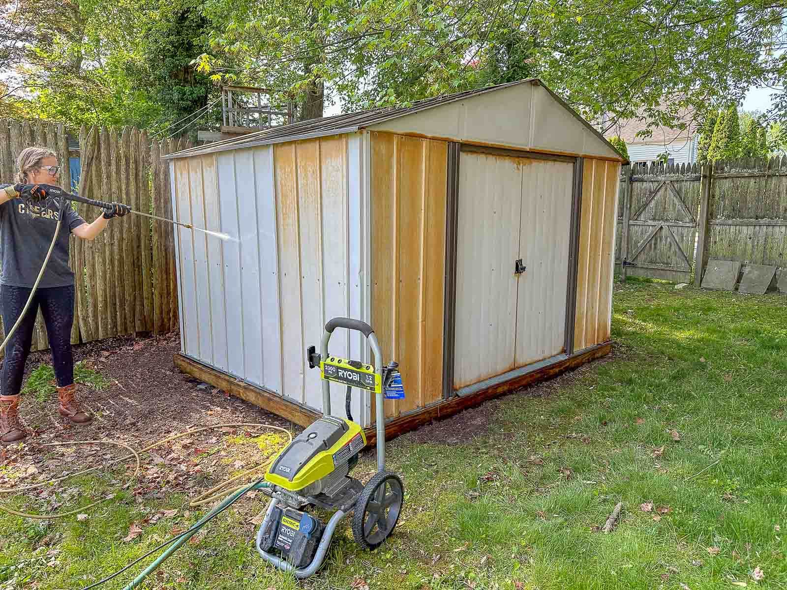 pressure washing the backyard shed