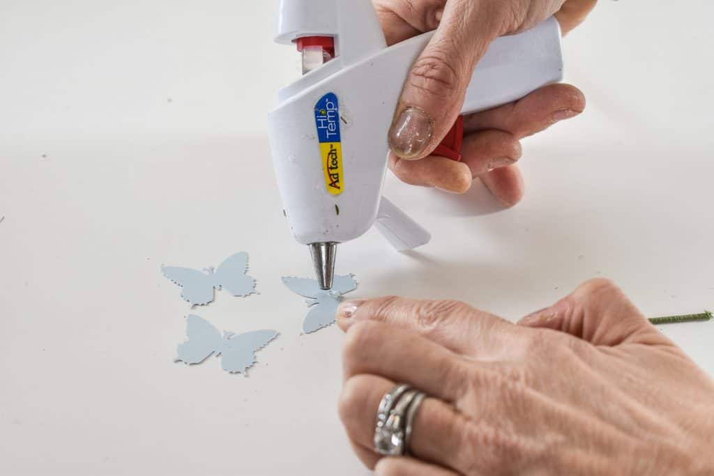 glue butterflies onto floral wire