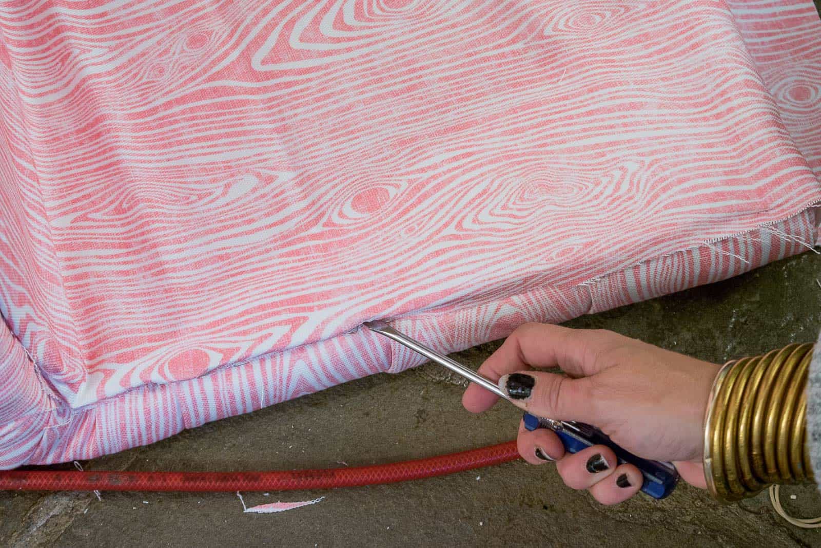 push fabric into teeth of tack strip