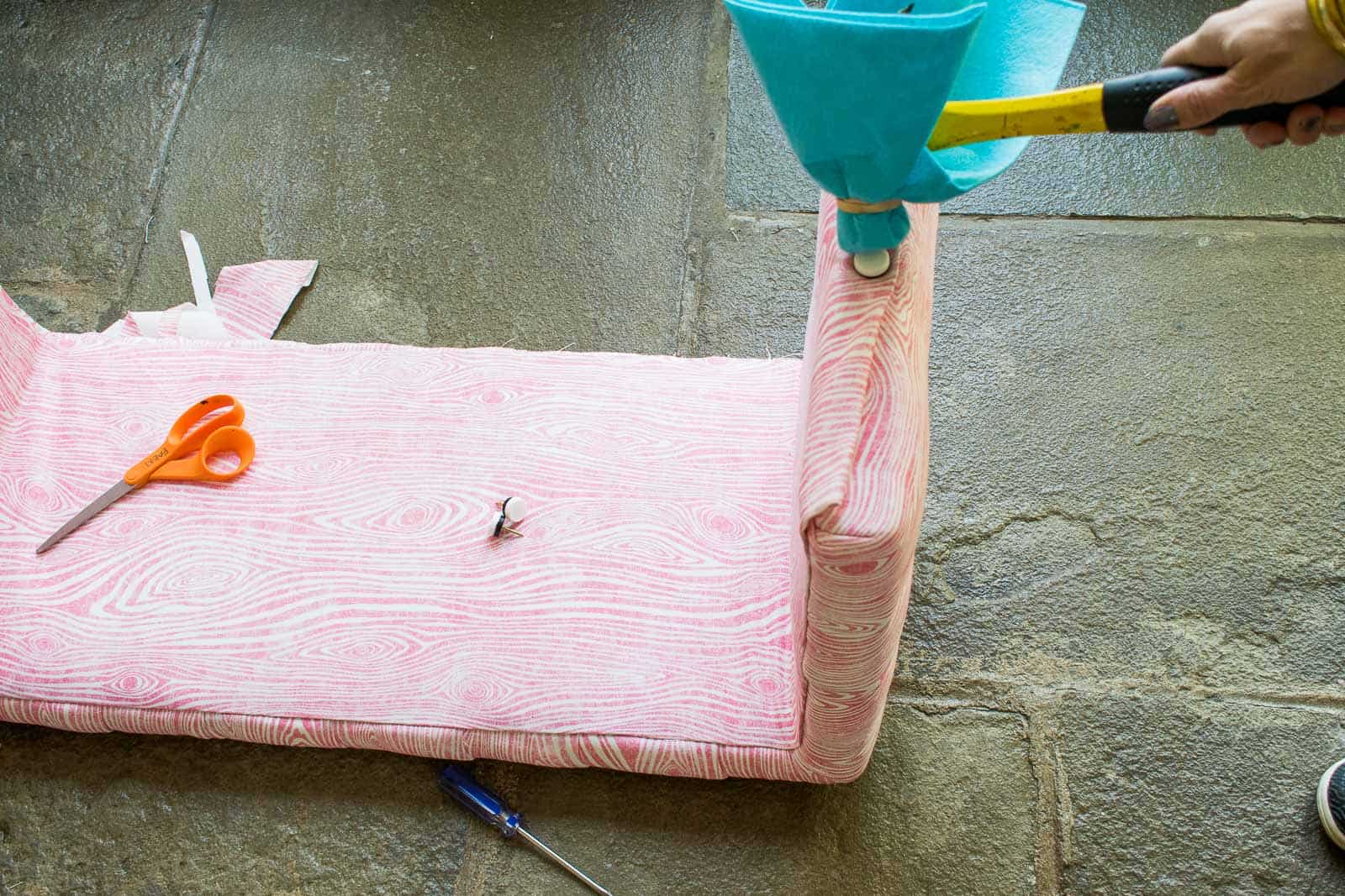 hammer in furniture caps to hold fabric in place