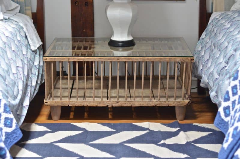 Guest bedroom with mixed patterns and textures. Gallery wall of embroidered art.