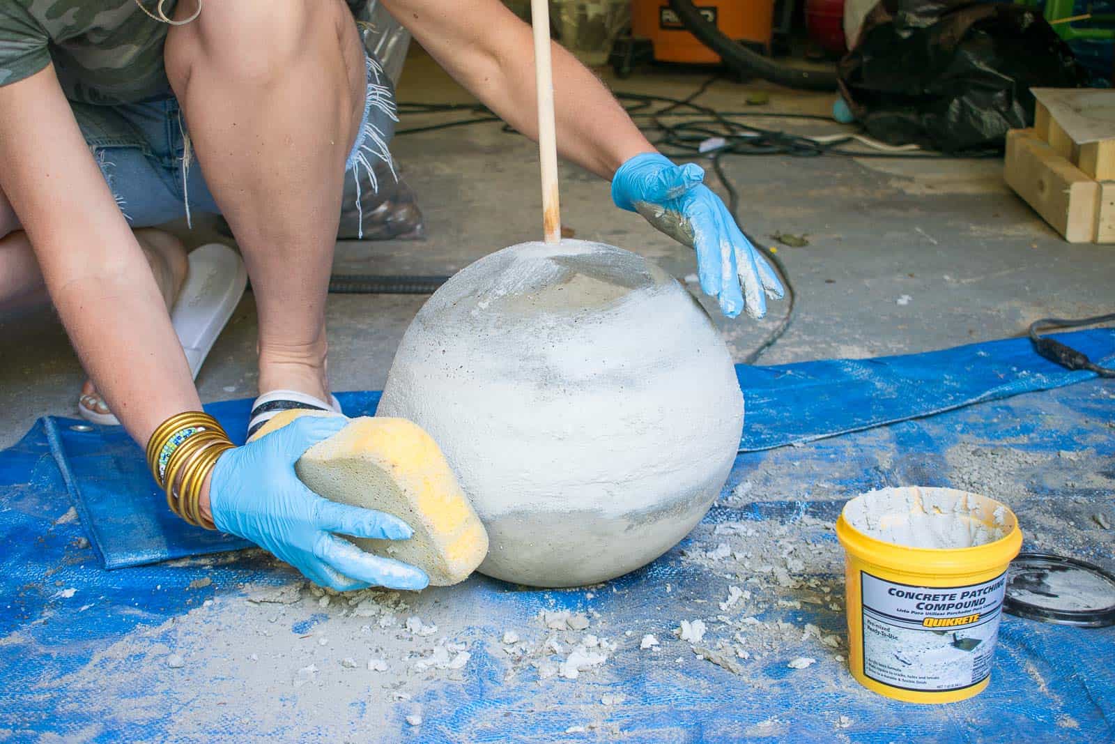 use a wet sponge to smooth out concrete