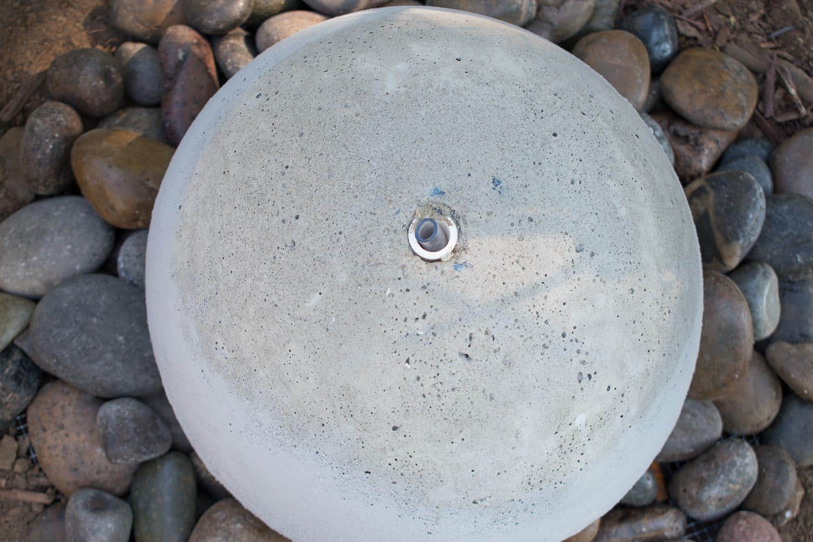place river rock around the fountain