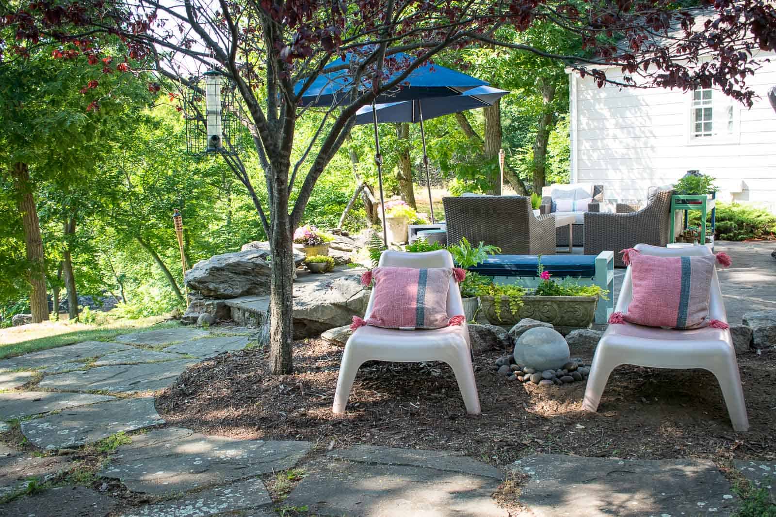 river rock around garden fountain