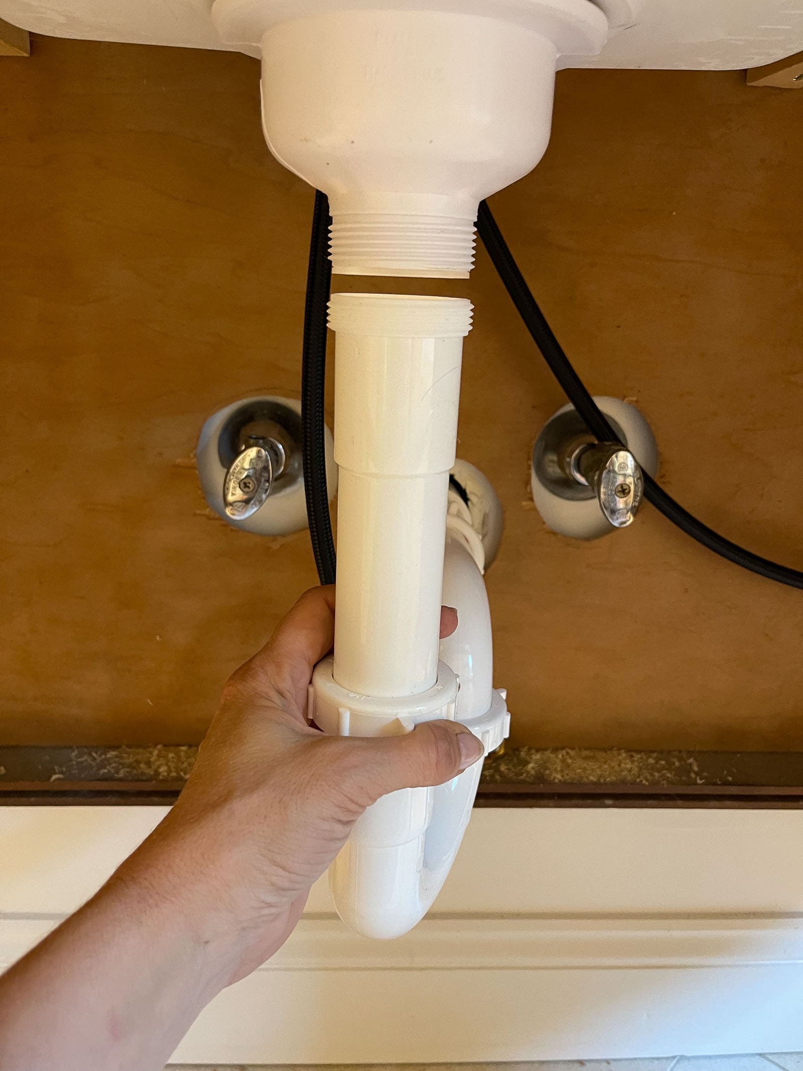 reattach plumbing under vanity