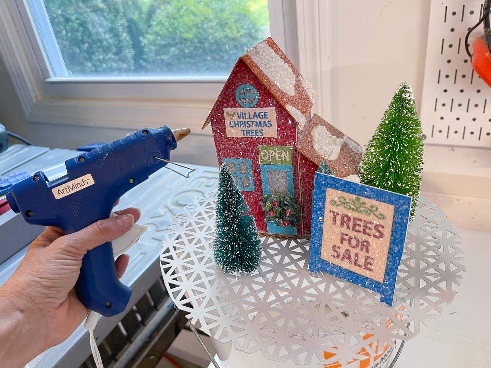 glue the items from holiday decor onto screen