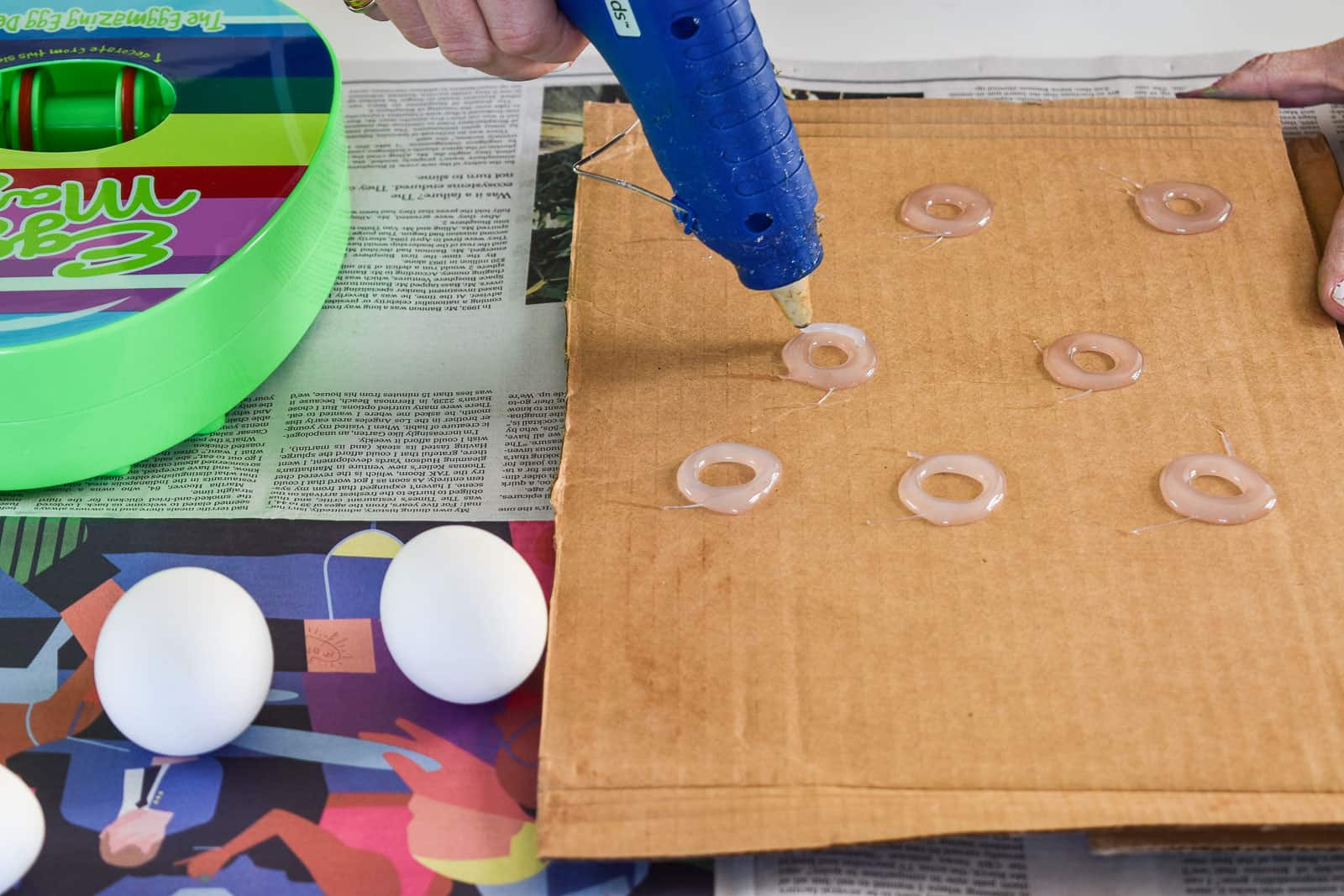 use a hot glue gun to make an egg stand