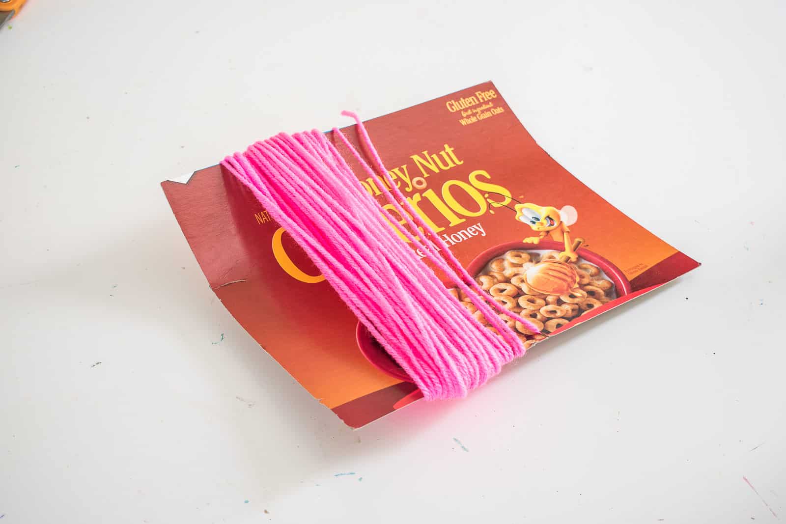wrap the yarn around the cardboard