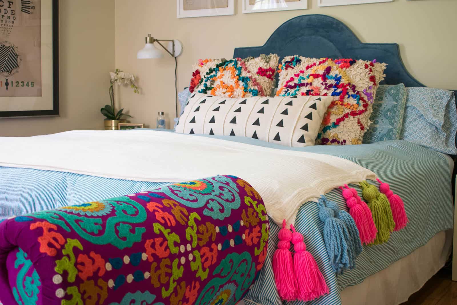 black and white pillow on master bed