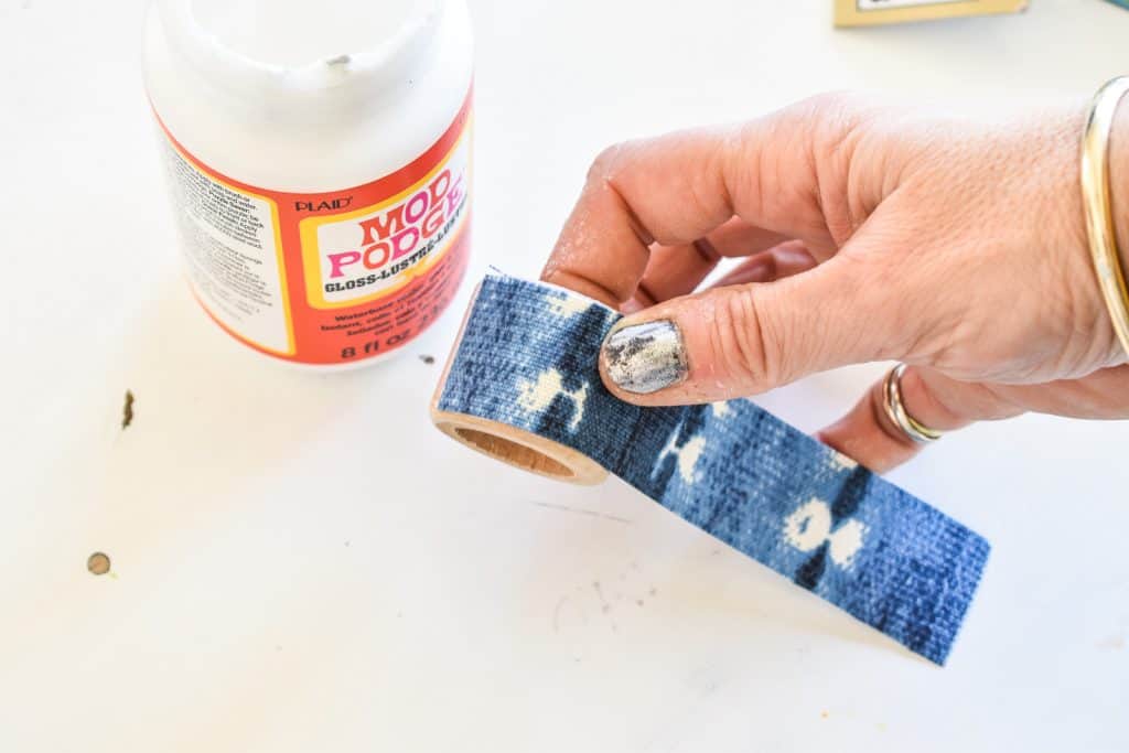 use mod podge to seal fabric onto napkin ring