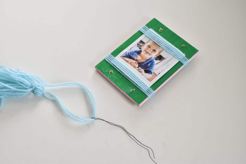 thread yarn through holes with floral wire