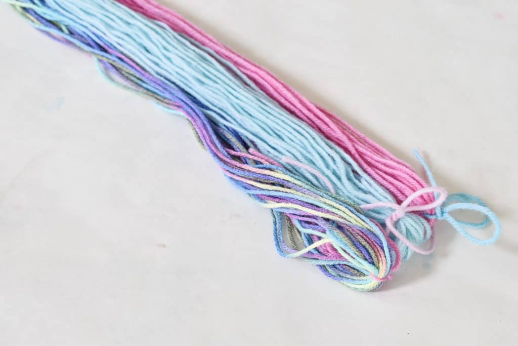 gather three clumps of yarn for unicorn tail