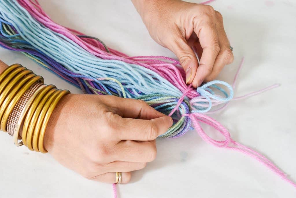 gather three clumps of yarn for unicorn tail