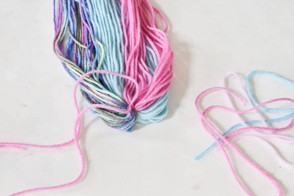 gather three clumps of yarn for unicorn tail