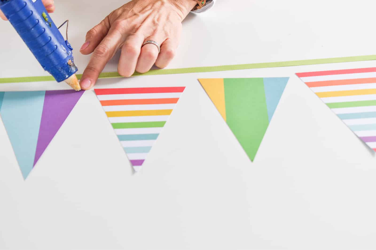 glue triangles onto ribbon for pennant