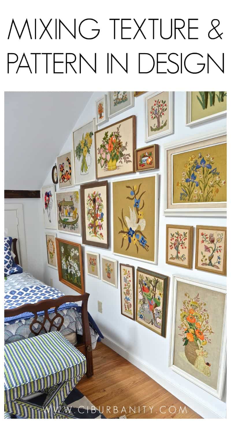 Guest bedroom with mixed patterns and textures. Gallery wall of embroidered art.