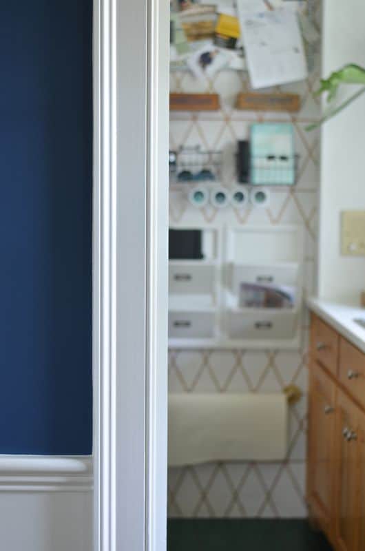 Fun kitchen command center with repurposed storage and graphic paint detail.