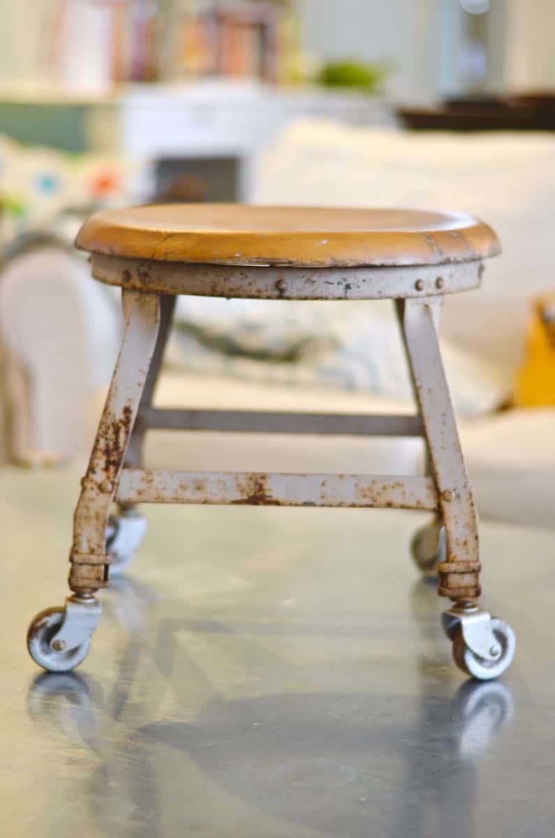 this old metal industrial stool got a makeover with a fresh coat of paint.