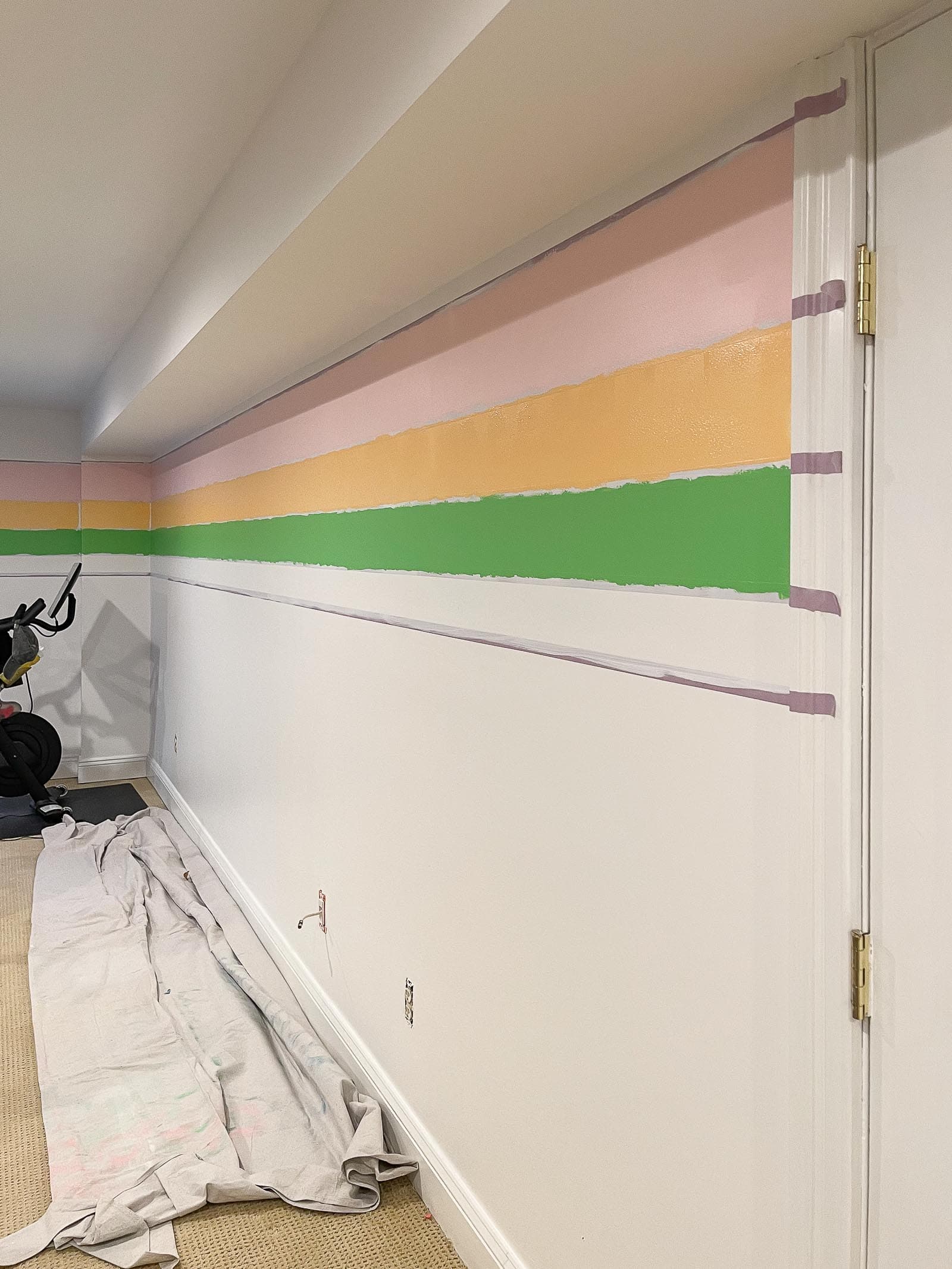 painting stripes on the wall