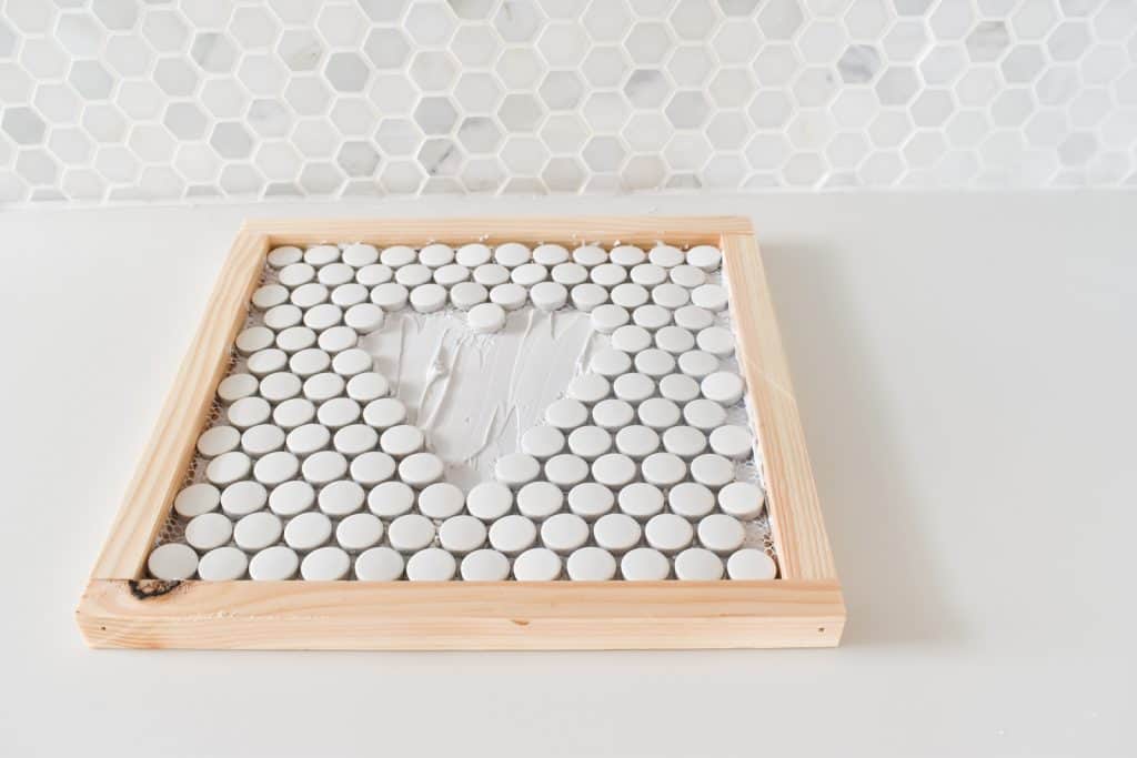 spread on mortar and place tiles
