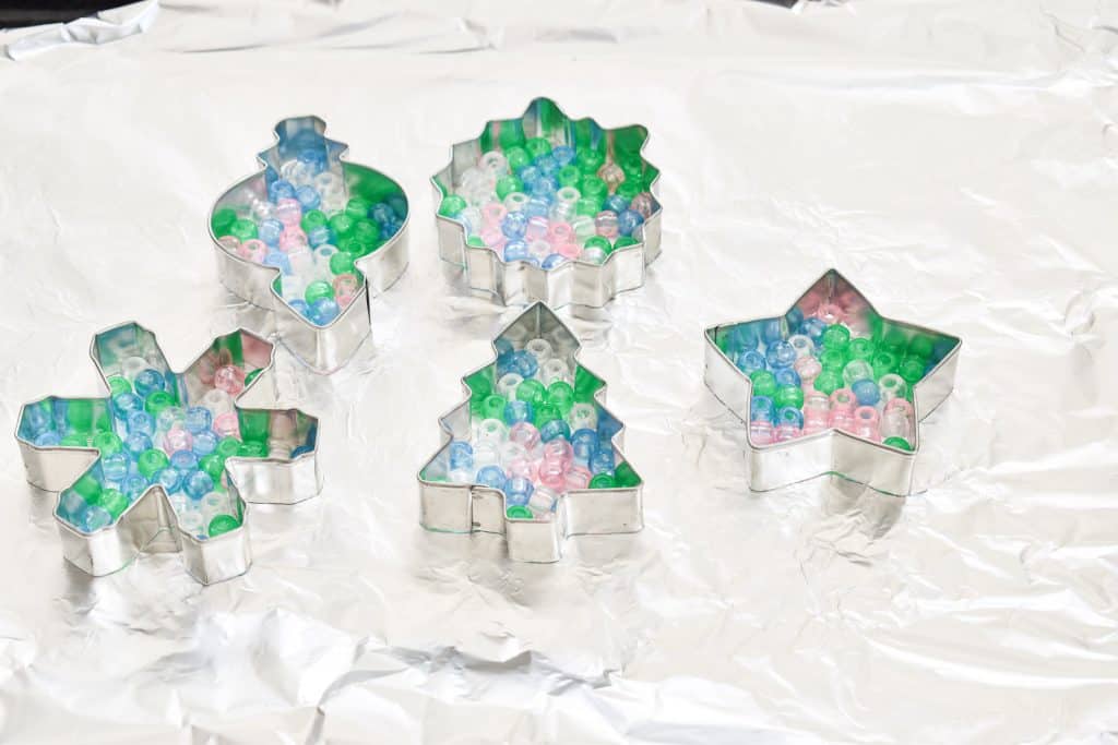 arrange pony beads in cookie cutter