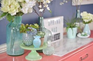 Lush coral and blue eclectic easter tablescape.