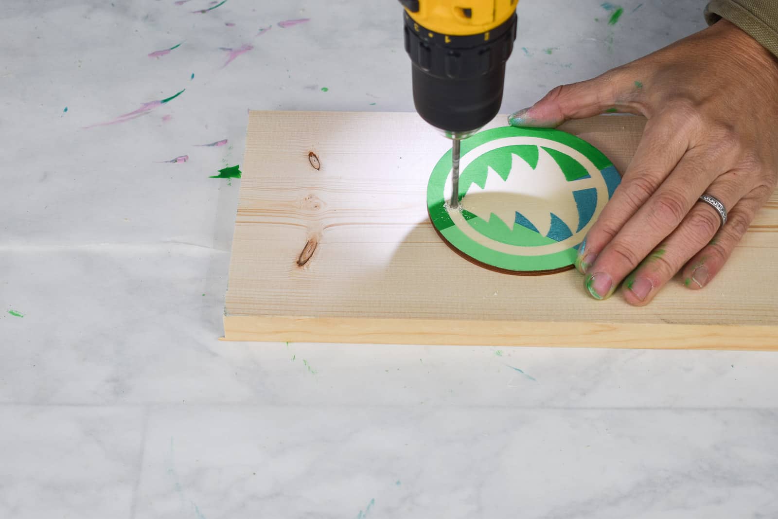 drill a hole and place ribbon in ornament