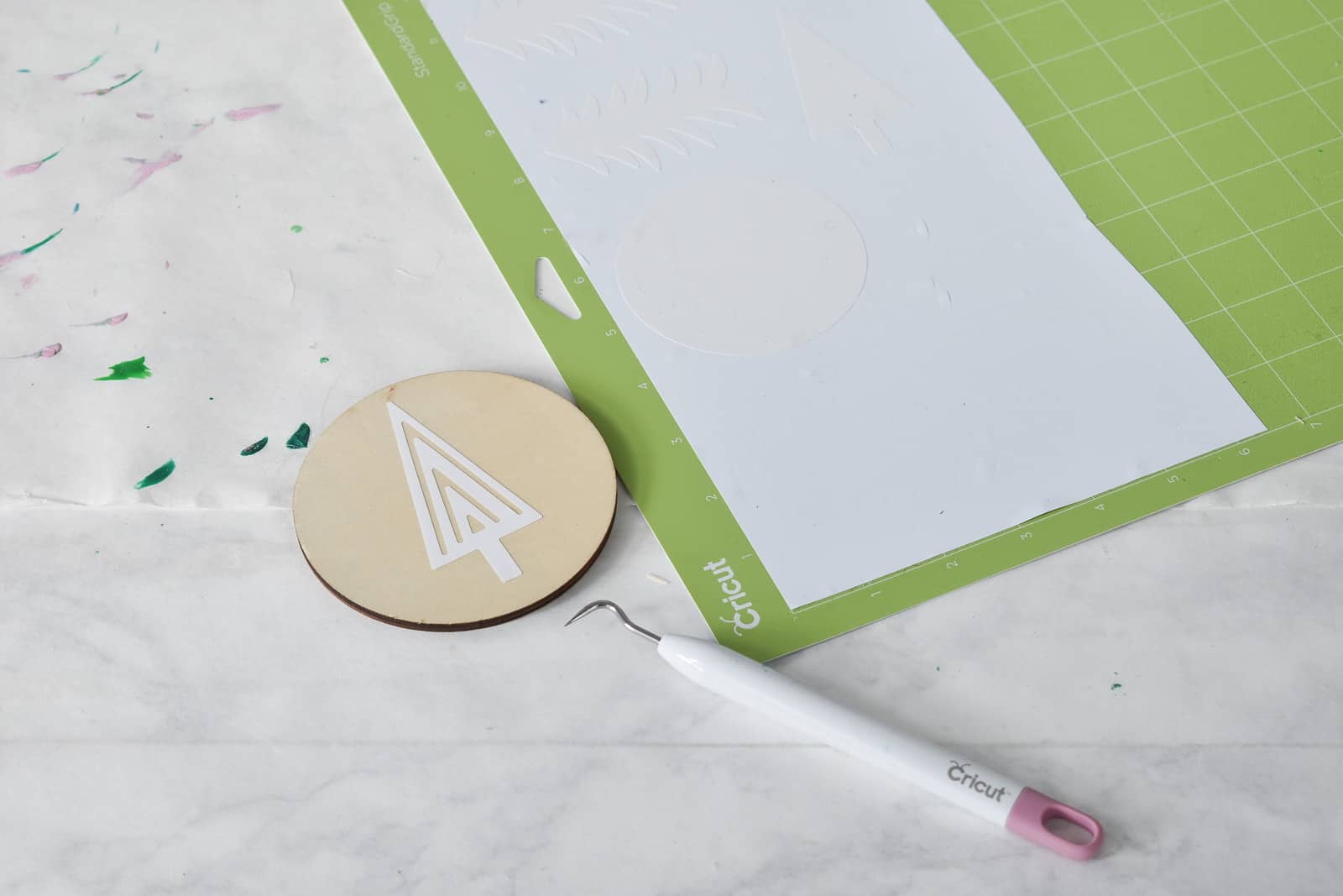 make a stencil and place it on the ornament