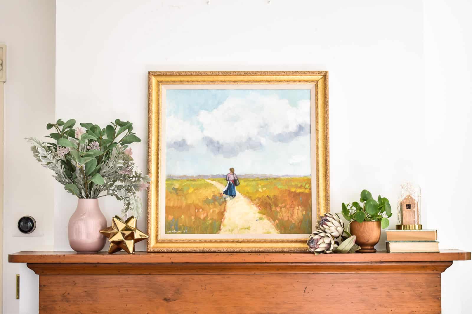 begin playing around with items on the mantel