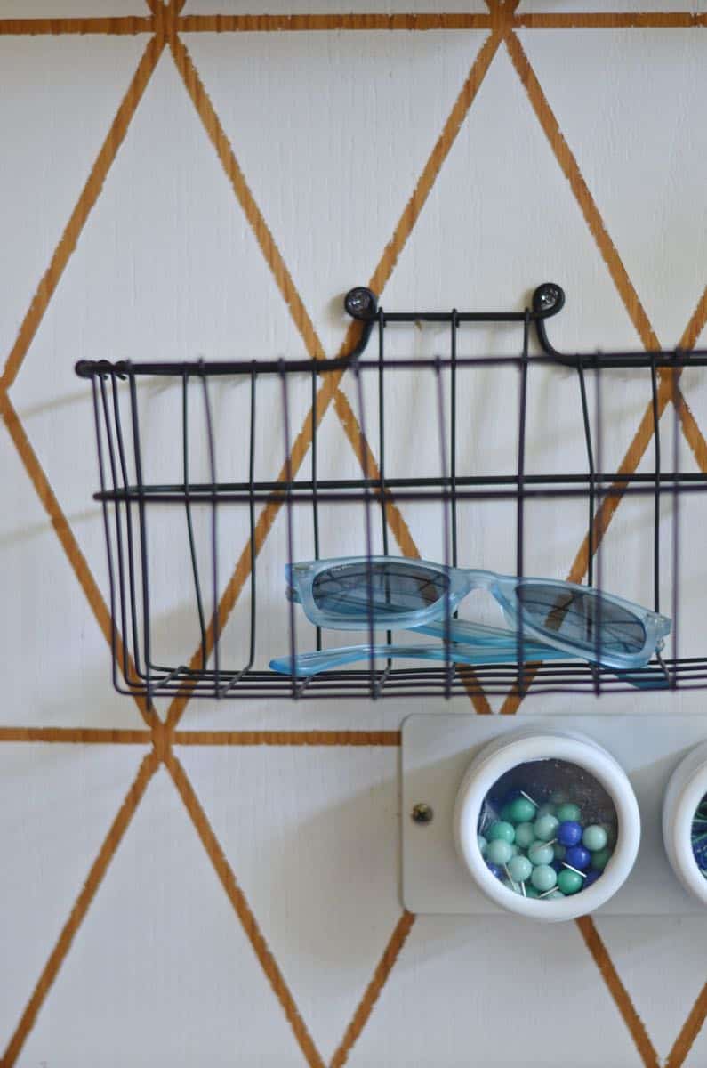 Organize your family with this creative use of one small kitchen wall.